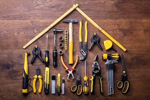 Provide maintenance or manuals to ensure the facility is optimized. House shape composed of tools