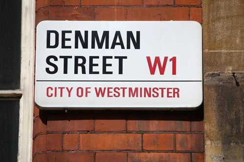 Street Sign saying Denman Street City of Westminster