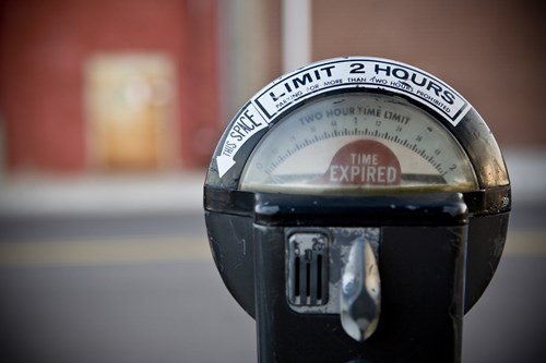 An old parking meter with a 2 hour limit