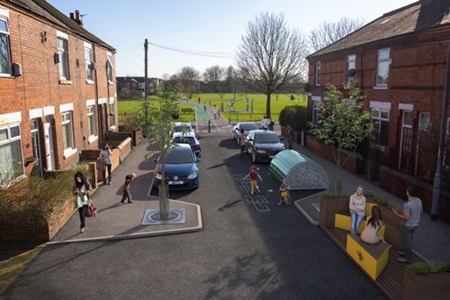 An artist's impression of a yellow parklet placed on a residential street with red brick terraces either side.