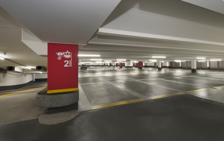 Red column with parking spaces in the background