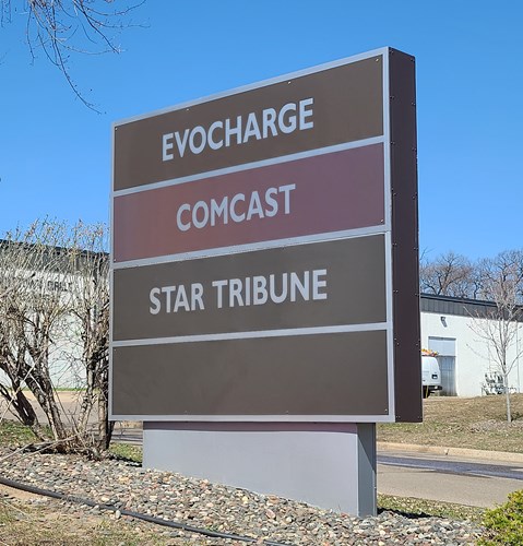 image of a sign with three companies, incl. EvoCharge