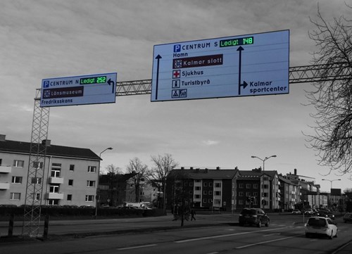 Wayfinding gantry showing parking facilities with available spaces