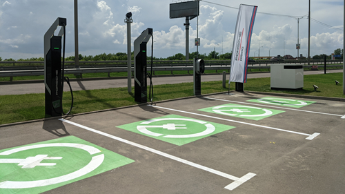 4 EV charging stations and parking bays by the roadside