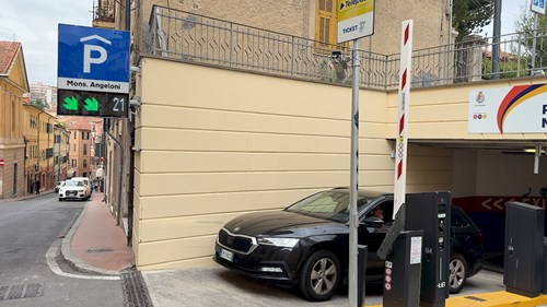 Car exiting from Angeloni Parking in Imperia and VMS panels