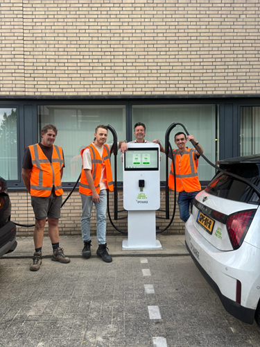 Opcharge reached a beautiful milestone: the installation of our very first fast charger three men at EV charging