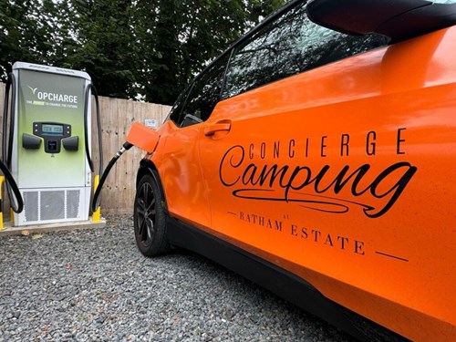 Opcharge EV hub charging a car.