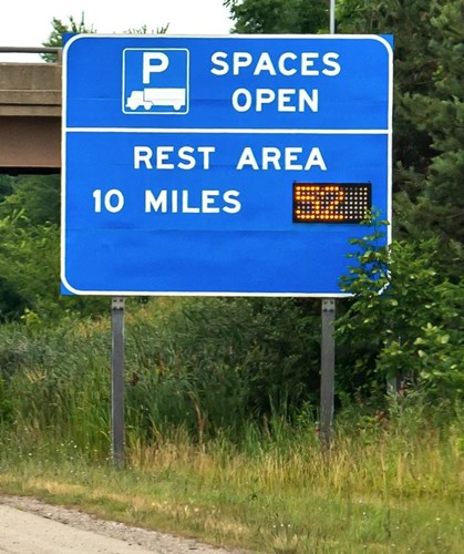 image of truck parking guidance signage next to roads