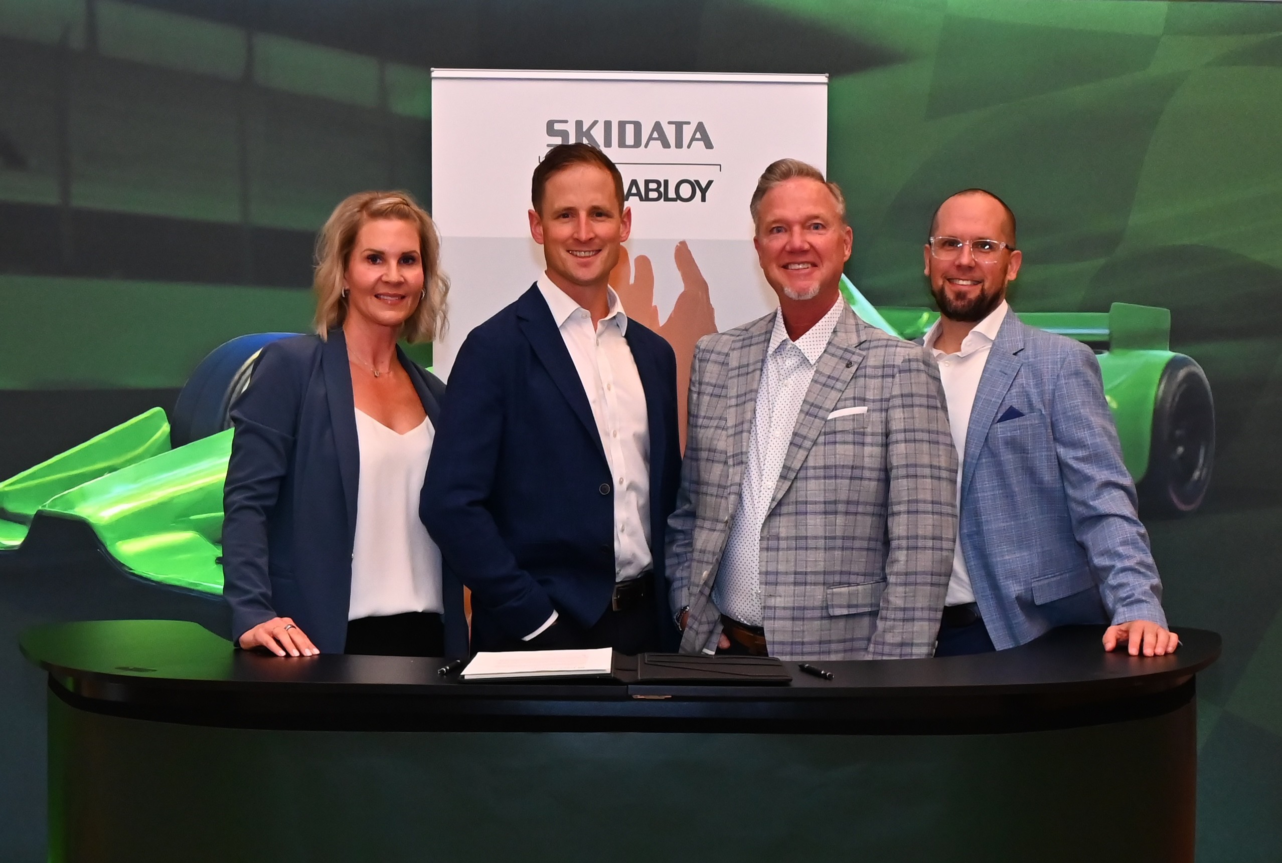 Names of people in first image from L to R:  Carmen Donnell, Managing Director North America, PayByPhone Jonny Combe, President and CEO, PayByPhone Christopher Archer, Senior Vice President, North America, SKIDATA Michael Ball, Vice President Sales, North America, SKIDATA