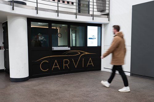 image of a man in front a CarVia kiosk