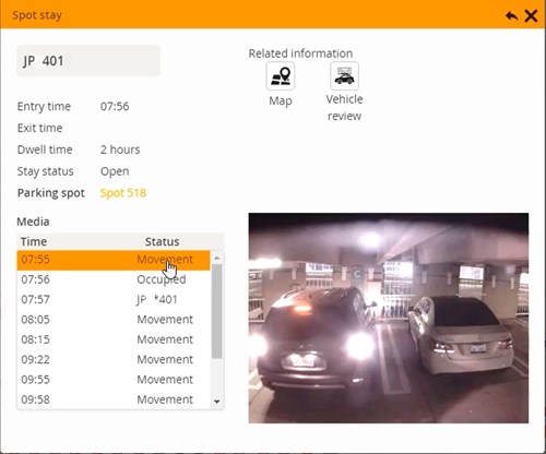 Computer screen showing software with CCTV image of a car