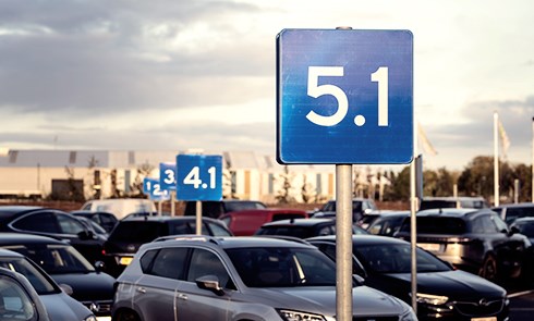 Parking lot with signs displaying area numbers