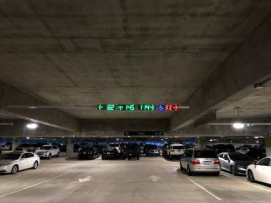Parking Guidance System in garage, display units showing empty spaces