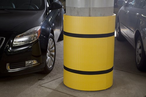 Yellow protection placed around a pillar in a parking garage