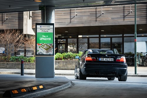 image of a car and a parking terminal