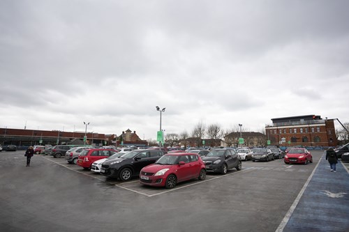 image of cars in a parking lot