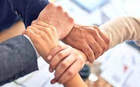 image of people holding hands by the wrists