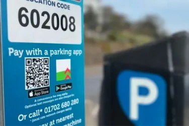 car park signage with QR code scam sticker