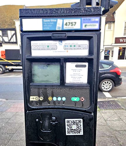 car park payment machine with QR code scam sticker