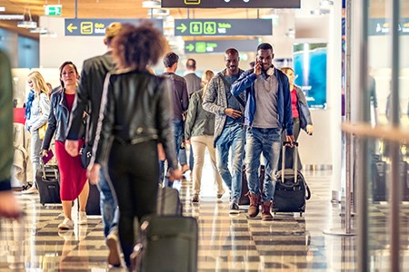 Airport passengers in terminal.