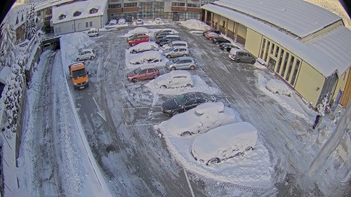 Aerial view of a snowy parking lot